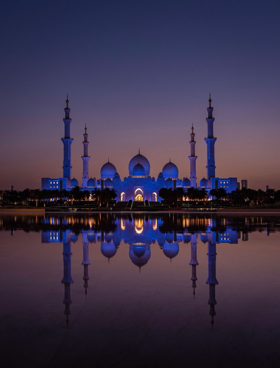 Sheikh Zayed Grand Mosque in Abu Dhabi reflected at dusk
